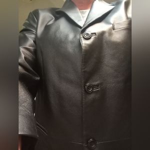 Leather coat. 3 button. Like new and not even broken in yet. Long, dress style.